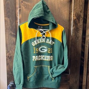 Women’s large Greenbay Packers hoodie. Green and yellow. Laced neck to tighten